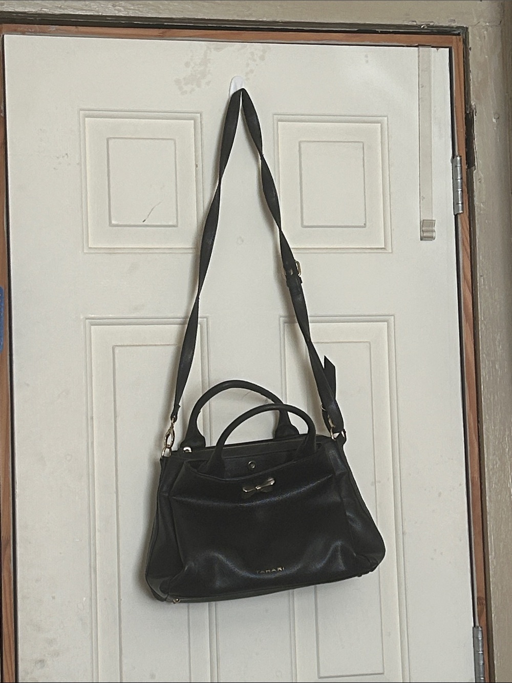 Classic Black Leather Satchel with Double Handles and Adjustable Strap